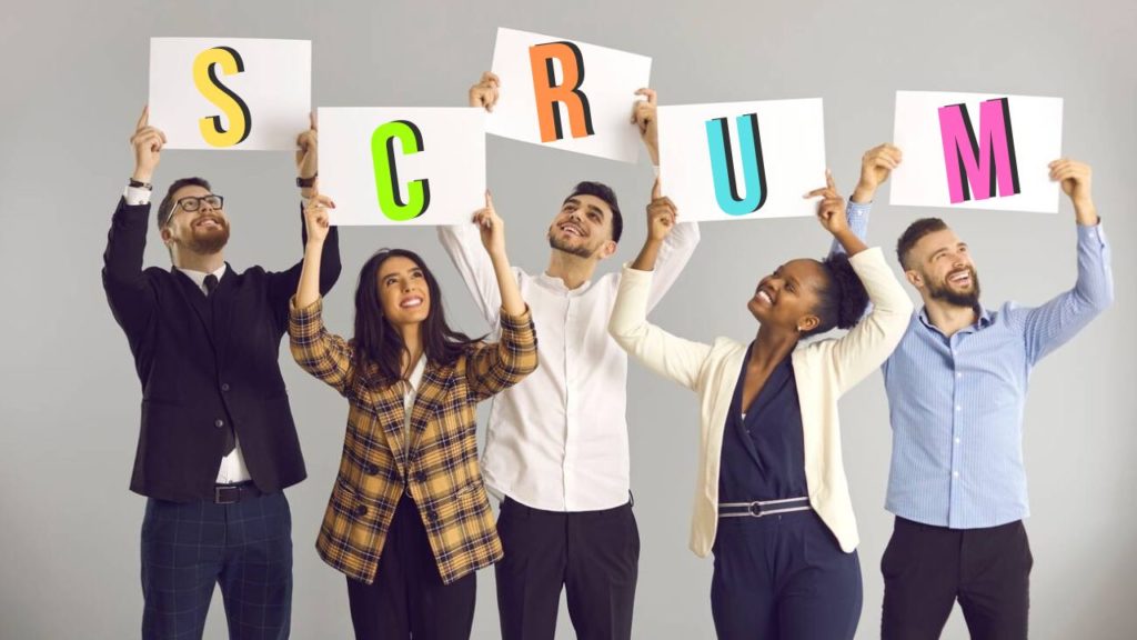 Image featuring a group of 5 people forming the word 'Scrum' with excitement about Scrum benefits and features